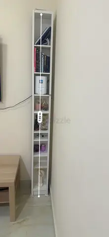Slim tall white shelving unit - narrow bookcase. Adjustable shelves