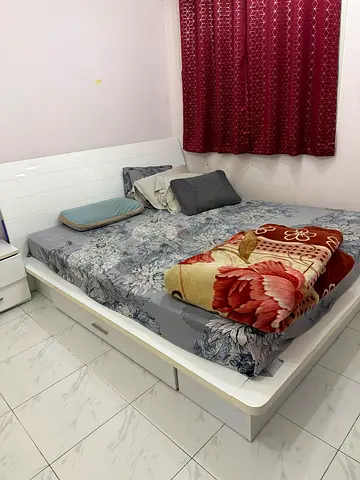 White queen-size bed frame with storage - good condition