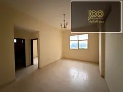 2BR hall in Al Jurf 1, central AC, 2 baths, spacious, near schools &amp; Ammar St, prime spot, ideal