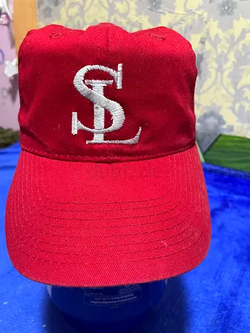 Red baseball cap with white embroidered letters - gently used