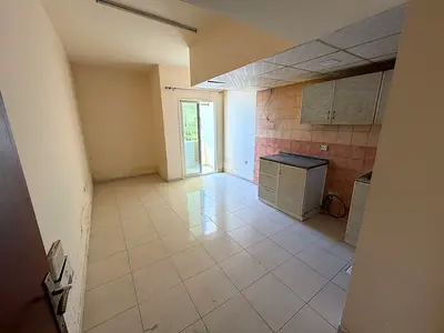 Studio with balcony _ central air conditioning _ natural lighting _ very special location _ easy to go out to Dubai and Sharjah _ free maintenance