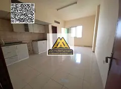 A distinctive studio for annual rent in Al Rawda 1 - Ajman, featuring a large space and a balcony wi