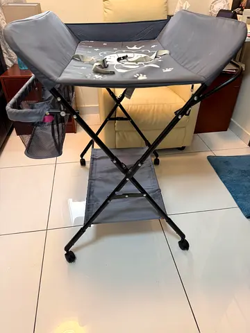Portable baby changing table with storage and wheels - grey