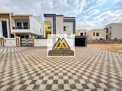 Al Helio 2, Ajman, brand new and first occupancy, located on a main road with a large setback area offering extra space and high privacy. This villa i