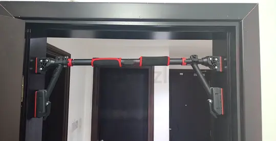 Adjustable Doorway Pull-Up bar / Chin-Up Bar (Portable) - Red/Black with foam grips.