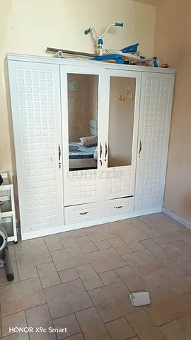 White 4-Door Wardrobe with Mirrored Center — Good Condition