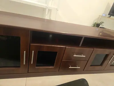 Dark wood entertainment unit with glass doors and shelving - good condition