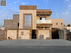 Two-story villa in Ajman, including electricity, water, and air conditioning, with freehold ownershi