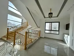 A distinctive villa for rent in Al Yasmeen, Ajman, featuring a spacious design with 5 bedrooms, 2 ma