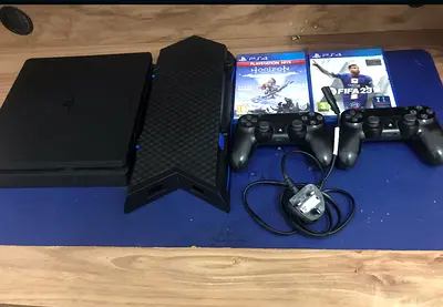 PlayStation 4 Slim bundle with 2 controllers and 2 games (FIFA 23  Horizon)