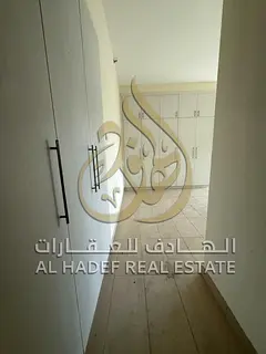 Three-bedroom apartment with a living room and maid's room for annual rent in Al Qasba, a prime 
