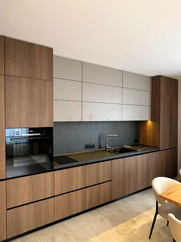 Modern fitted kitchen cabinets with integrated appliances - walnut finish