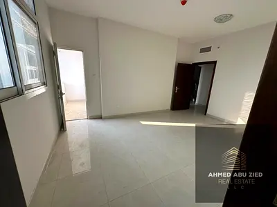 Beautiful two-bedroom apartment with a living room, first occupancy opportunity, 3 bathrooms, 2 balconies, and parking in Al Rumaila, near Ajman Corni