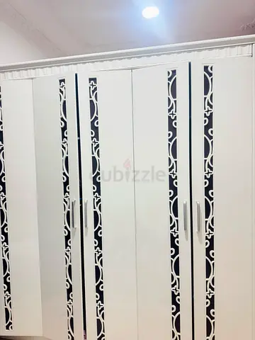 Large 6-Door White Wardrobe with Decorative Lattice Detail
