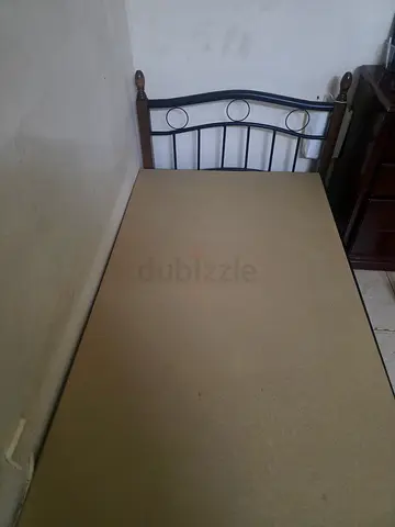 Single metal bed frame with wooden posts - used