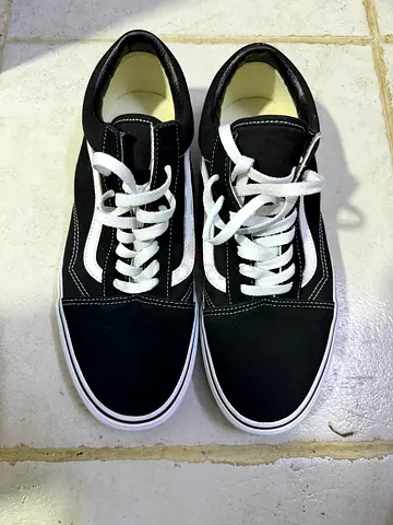 Black low-top Vans-style sneakers, size not specified, gently used