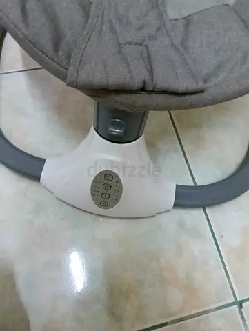 Used baby rocker/soothing bouncer with vibration and music (grey)