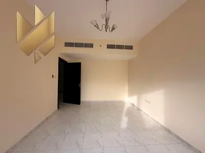 Two bedrooms and a living room for rent in New Muwailih, with a separate living room and free parking.