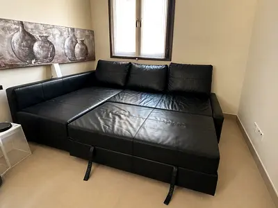Large Black Leather Corner Sofa Bed with storage - great Condition