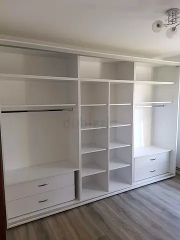 Built-in White Walk-in Wardrobe with Shelves and Drawers