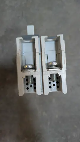 Pair of white sliding door/window roller assemblies (used)