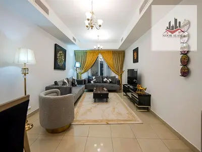 Sharjah, Al Taawun, second building, direct lake view, one bedroom, large living room, kitchen, two bathrooms, and a balcony overlooking the lake. Pri