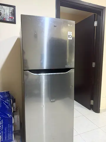 Stainless Steel Double-Door Refrigerator (Top Freezer) - Good Condition