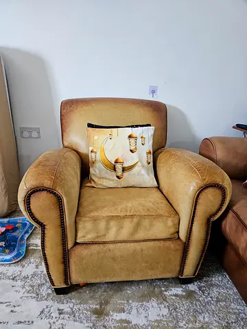 Comfortable vintage-style brown leather armchair