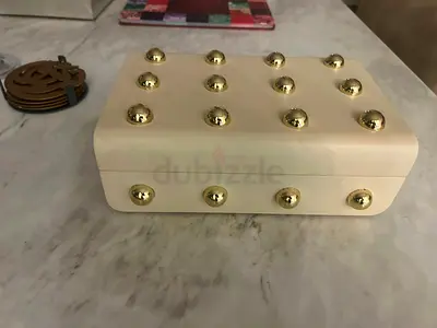 Cream clutch jewelry box with gold stud accents - small storage case