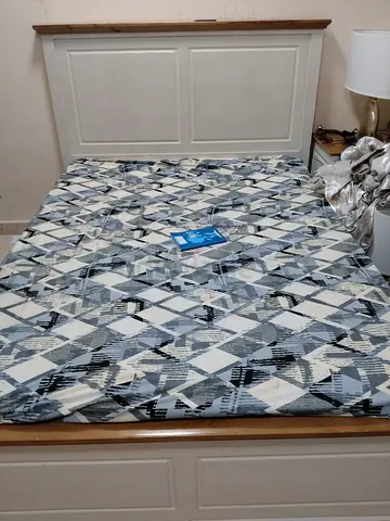 Bed with side table