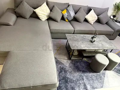 طقم كنب حرف ل بحالة ممتازة جدا بيع لغرض السفر Large L-shaped Grey Fabric Sofa