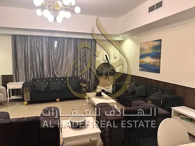 A stunning, fully furnished apartment with luxurious furnishings is available for annual rent in Al Taawun, near the Dubai exit. It includes free air