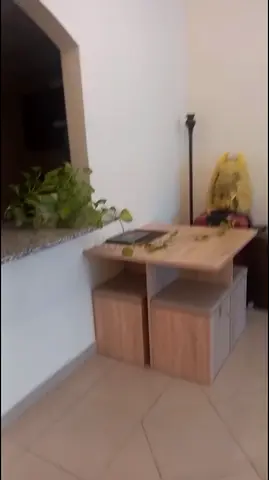 Compact wooden side table with four storage stools