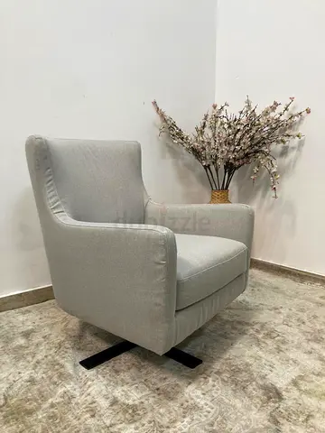 Upholstered swivel arm chair