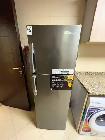 Silver double-door refrigerator in good working condition