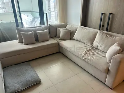 Light grey / crème colour  L-shaped fabric sofa with cushions - good condition