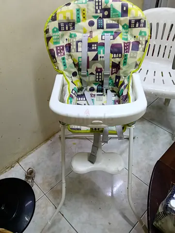 Used baby high chair with removable tray and safety straps