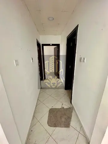 Two-bedroom apartment with a spacious living room in New Muwaileh, modern building, close to all services and schools, in a prime location