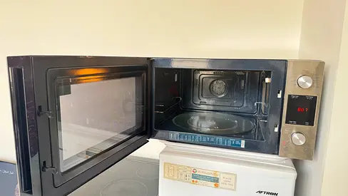Used countertop microwave oven — stainless steel, good working condition