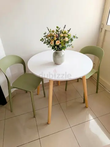 Compact Round Dining Table with 2 Green Chairs - Scandinavian Style