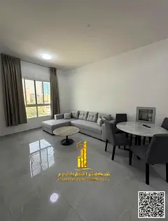 Luxurious two-bedroom apartment with a living room, fully furnished, and featuring a balcony. Ajman,