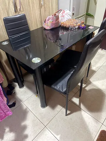 Glass Dining Table with 4 Black Leather Chairs - Good Condition