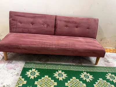 Compact pink velvet convertible sofa bed - good condition