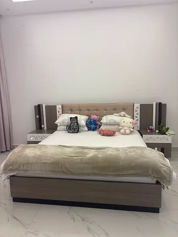 Modern queen bed with headboard and integrated bedside tables