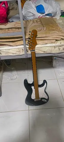 Used Black Electric Guitar - Full Size