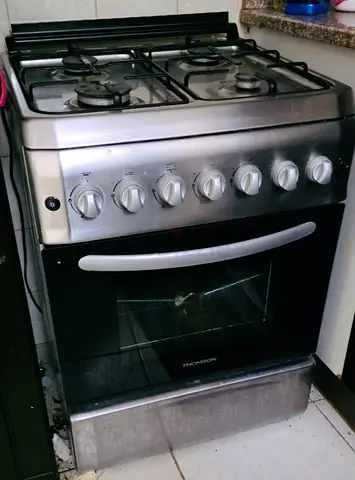 Used stainless steel freestanding gas oven and stove - 4 burners