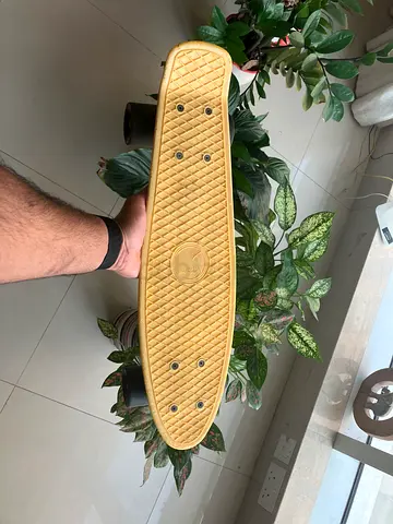 Yellow  penny board skateboard - compact cruiser board