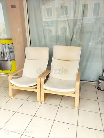 Pair of IKEA Poäng-style Armchairs in Light Wood with Cream Cushions.