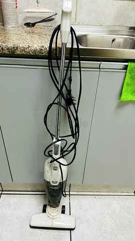 Used upright stick vacuum cleaner - compact and functional