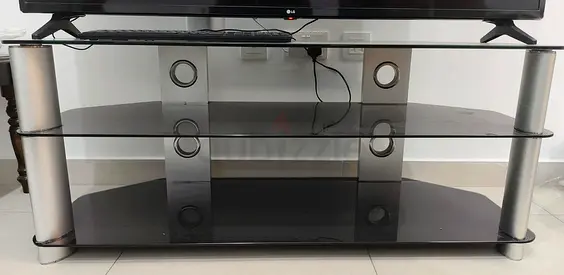 Glass TV Stand or Center Table with 3 Shelves and Silver Pillar Supports In good condition